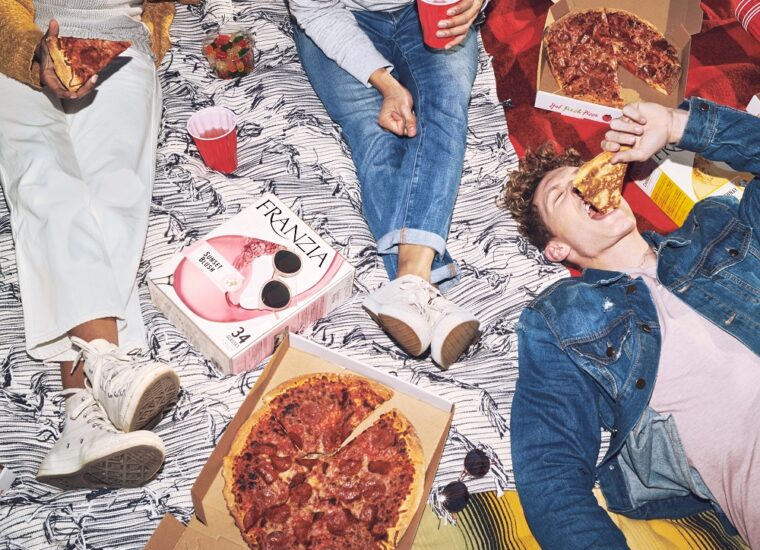 Friends eating pizza and drinking Franzia wines
